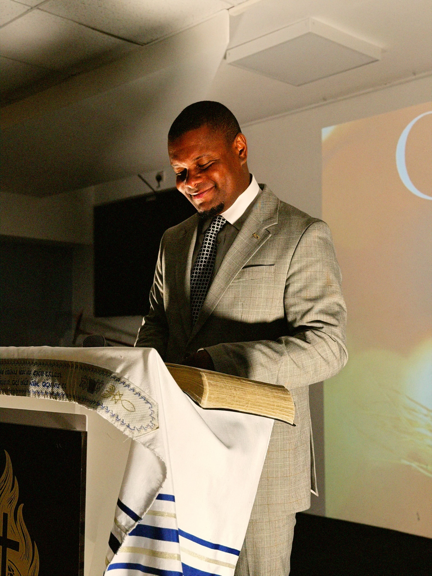 A pastor preaching at AGGF UK