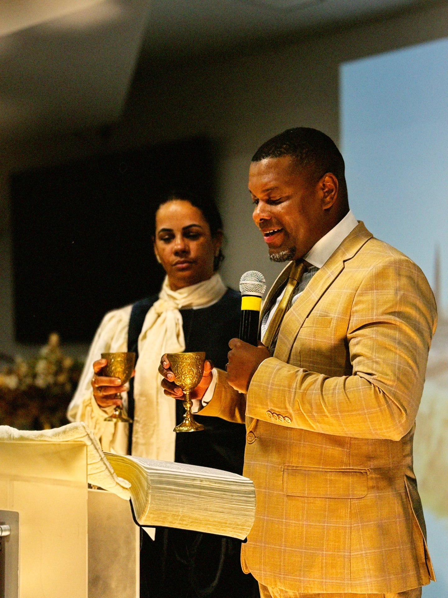 AGGF UK leaders serving Holy Communion